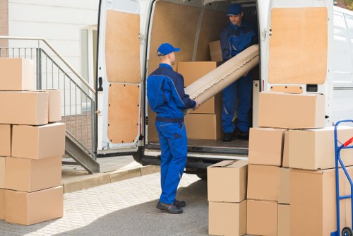 Packed household boxes and furniture ready for a Maida Vale move