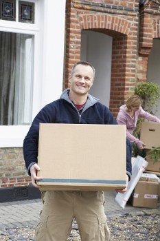 Furniture collection team handling bulky items in a Maida Vale residential street