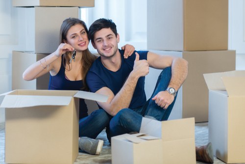 Moving team handling boxes safely during a local van service