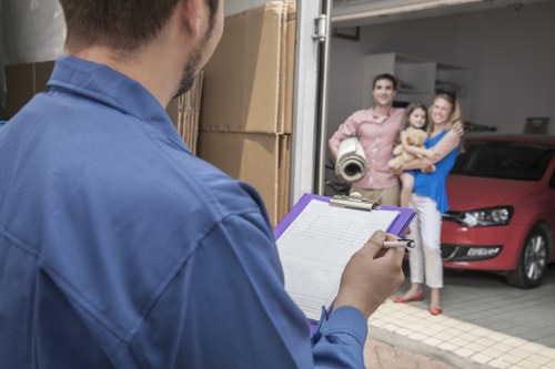 Moving team loading furniture into a truck in West London