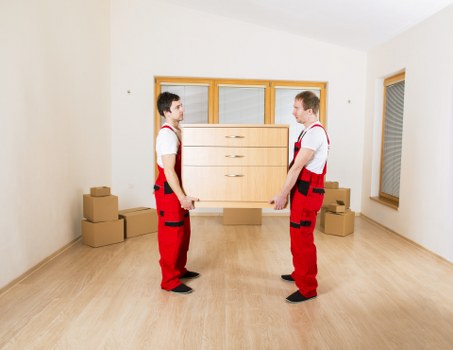 Professional moving van loading boxes and furniture in Maida Vale