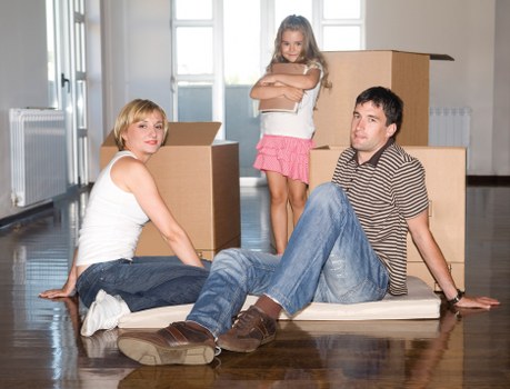 Packed office boxes and furniture ready for transport